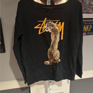 Stüssy crewneck sweatshirt featuring a bold leopard graphic size small